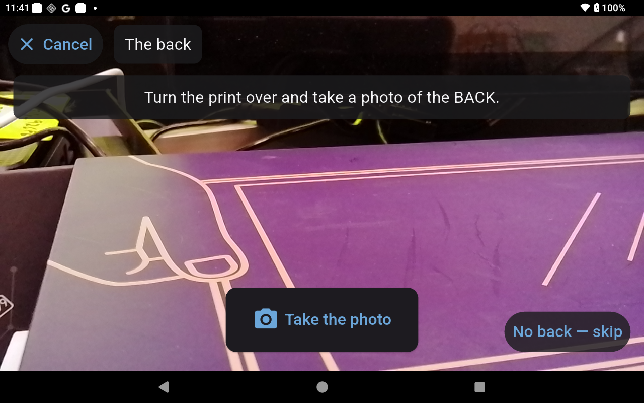 The camera screen for taking a photo of the back of a print, with a Cancel button at the top left and a No back, skip button.
